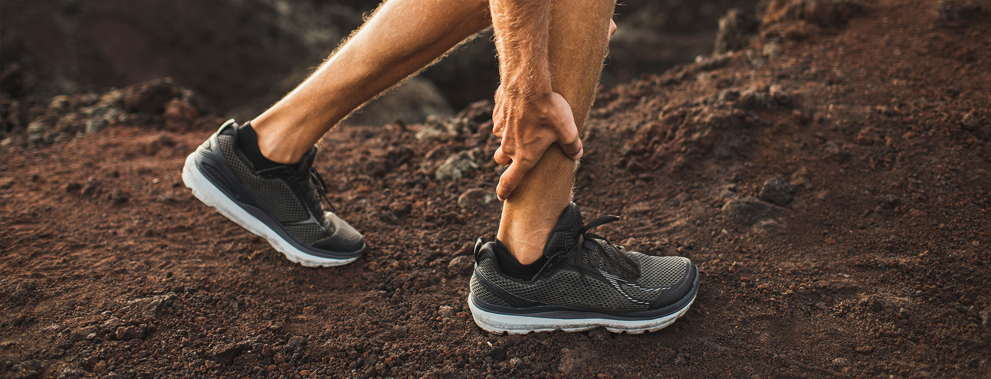 Person Holding Painful Achilles Tendon